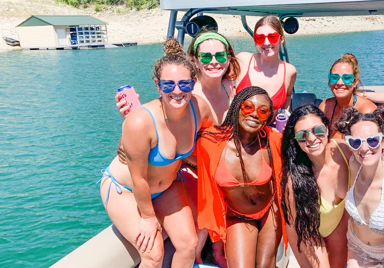 Group of women in their swimsuits on a pontoon boat