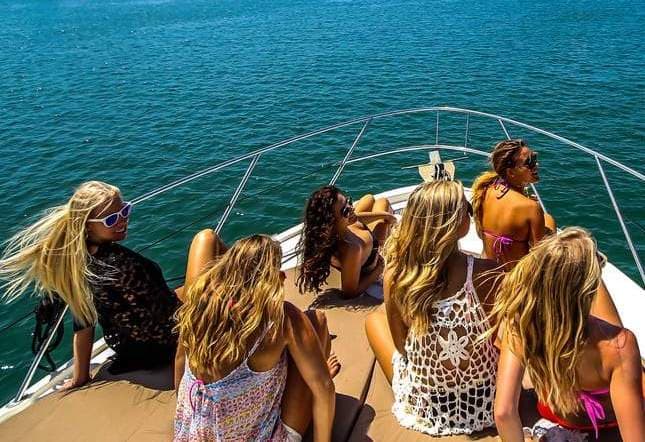Group of women sitting on a yacht